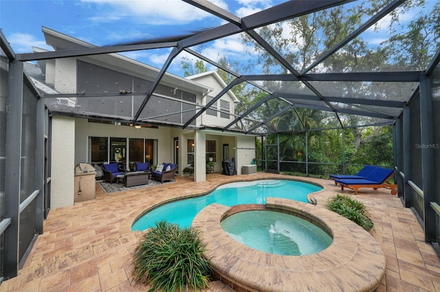 view of pool with a pool with connected hot tub, a lanai, an outdoor hangout area, a patio, and ceiling fan