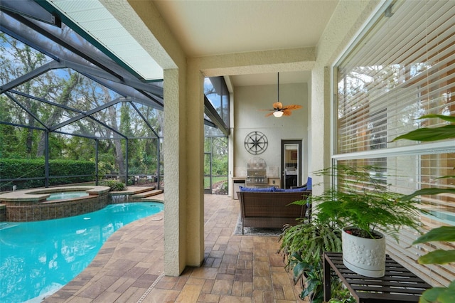 view of swimming pool with a patio, grilling area, a ceiling fan, and glass enclosure