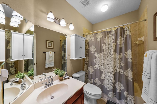 full bathroom with shower / bath combo, a textured ceiling, visible vents, toilet, and vanity