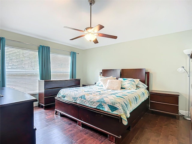 bedroom with a ceiling fan and hardwood / wood-style floors