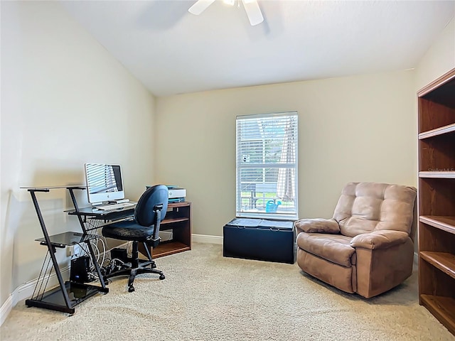 carpeted office space with baseboards and ceiling fan