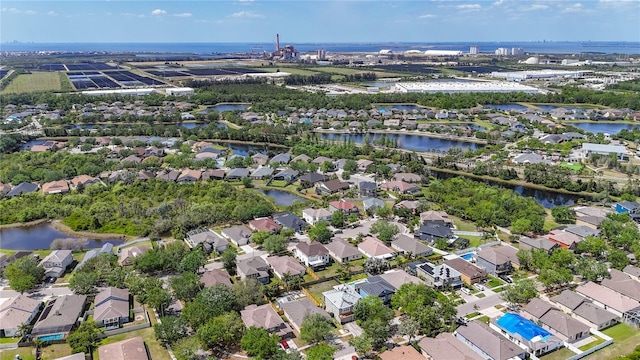 birds eye view of property featuring a water view and a residential view