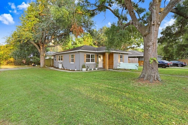 2001 E Idlewild Ave, Tampa, FL 33610 - ranch-style home with fence and a front lawn