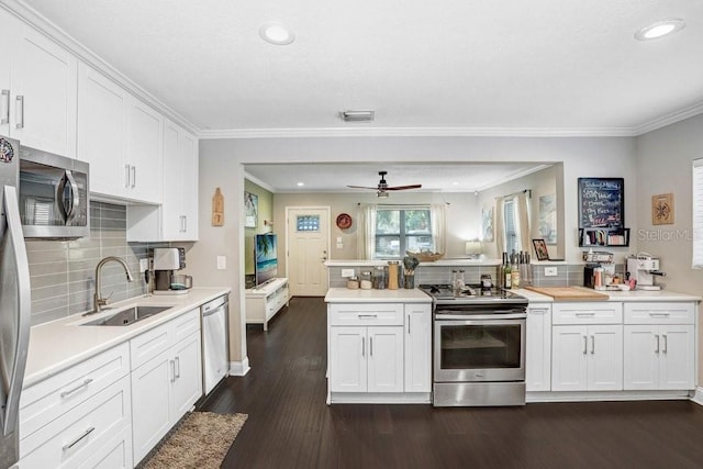 2001 E Idlewild Ave, Tampa, FL 33610 - kitchen featuring light countertops, visible vents, white cabinets, stainless steel appliances, and a sink