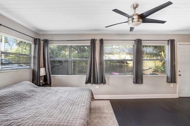 2001 E Idlewild Ave, Tampa, FL 33610 - bedroom featuring baseboards, ornamental molding, wood finished floors, and a ceiling fan