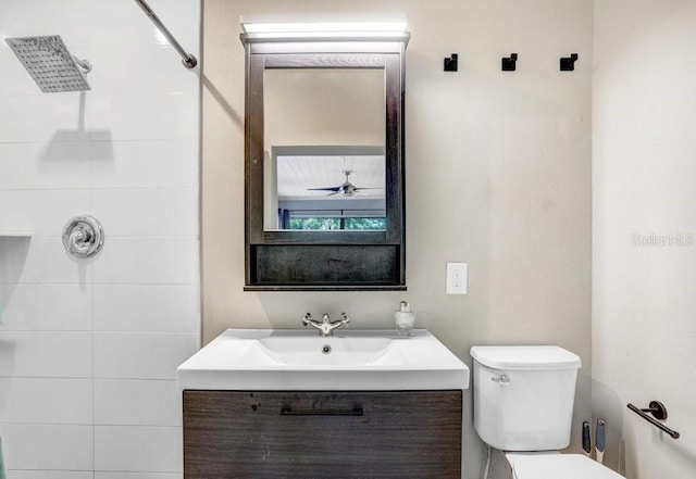 2001 E Idlewild Ave, Tampa, FL 33610 - bathroom with toilet, vanity, and tiled shower