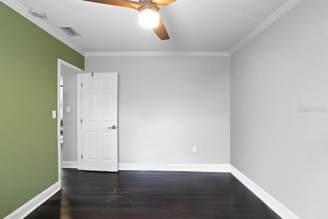 2001 E Idlewild Ave, Tampa, FL 33610 - spare room featuring crown molding, a ceiling fan, dark wood finished floors, baseboards, and visible vents