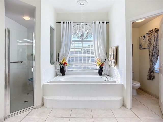 3625 Gaviota Dr, Ruskin, FL 33573 - full bath with a shower stall, tile patterned floors, a bath, an inviting chandelier, and toilet