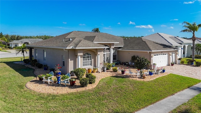 3625 Gaviota Dr, Ruskin, FL 33573 - single story home featuring a garage, a front yard, stucco siding, and decorative driveway