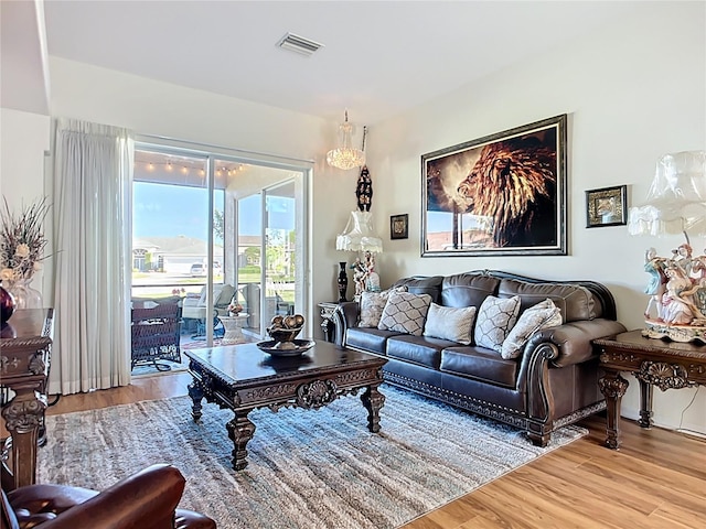 3625 Gaviota Dr, Ruskin, FL 33573 - living room featuring visible vents and light wood-style flooring