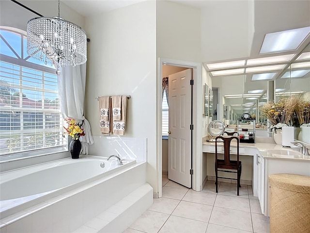 3625 Gaviota Dr, Ruskin, FL 33573 - full bathroom with a garden tub, vanity, tile patterned floors, and an inviting chandelier