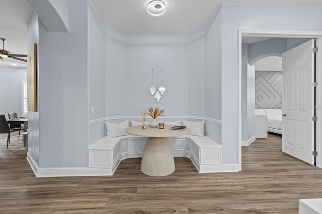 14521 Mirasol Manor Ct, Tampa, FL 33626 - hallway with arched walkways, wood finished floors, and baseboards