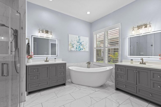 14521 Mirasol Manor Ct, Tampa, FL 33626 - bathroom with a marble finish shower, two vanities, and marble finish floors