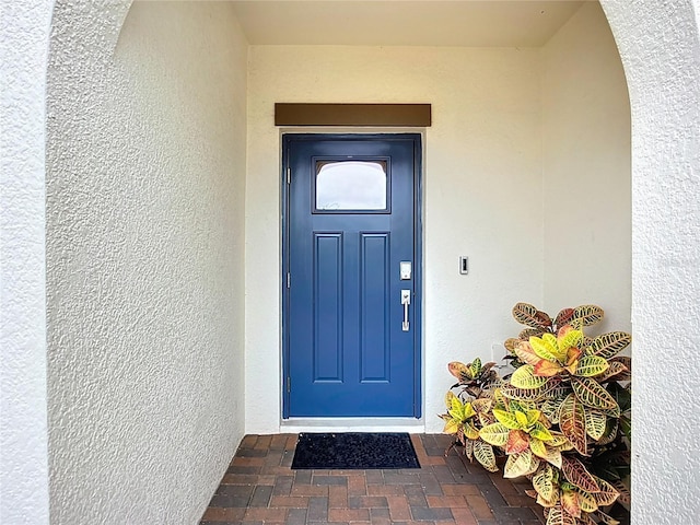 17228 Holly Well Ave, Wimauma, FL 33598 - view of exterior entry featuring stucco siding