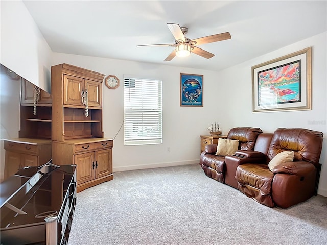 17228 Holly Well Ave, Wimauma, FL 33598 - living area with light colored carpet and a ceiling fan