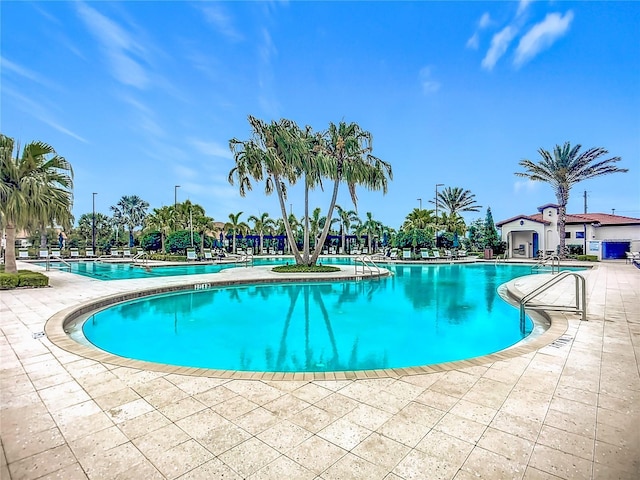 17228 Holly Well Ave, Wimauma, FL 33598 - community pool with a patio area