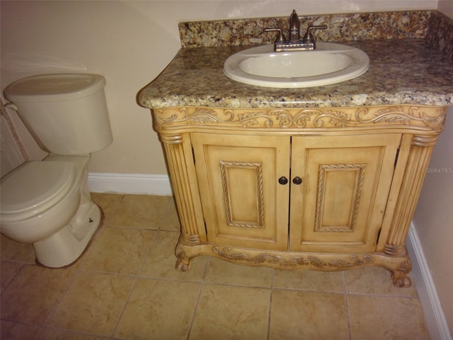 665 Oak Harbour Dr Unit 115, Altamonte Springs, FL 32701 - bathroom featuring toilet, tile patterned flooring, baseboards, and vanity