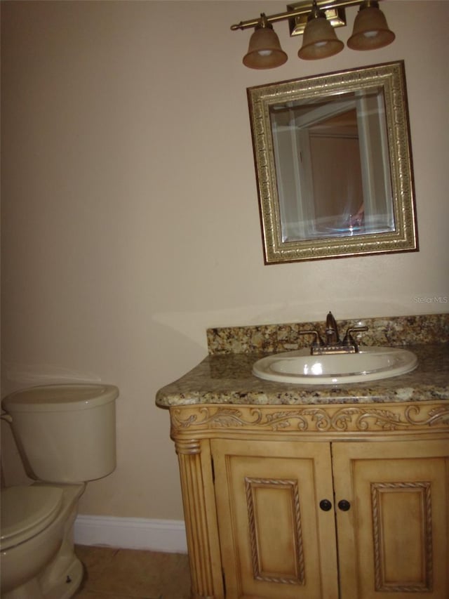 665 Oak Harbour Dr Unit 115, Altamonte Springs, FL 32701 - half bathroom with tile patterned flooring, vanity, baseboards, and toilet