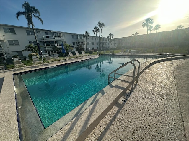 community pool featuring fence
