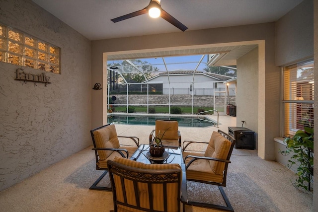 exterior space with a swimming pool and ceiling fan