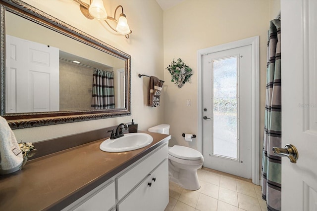 full bathroom featuring tile patterned flooring, toilet, vanity, and a shower with shower curtain