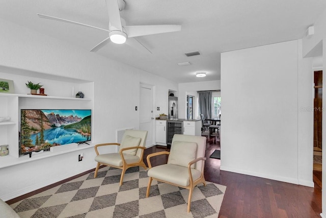 129 NW Lincoln Cir N, Saint Petersburg, FL 33702 - living area with wood finished floors, visible vents, ceiling fan, and wine cooler