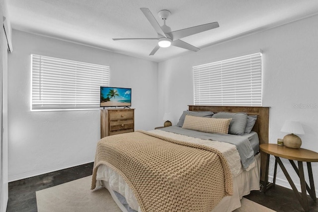 129 NW Lincoln Cir N, Saint Petersburg, FL 33702 - bedroom with baseboards and ceiling fan