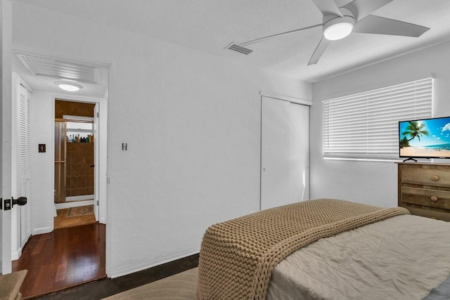 129 NW Lincoln Cir N, Saint Petersburg, FL 33702 - bedroom with baseboards, wood finished floors, visible vents, and a closet