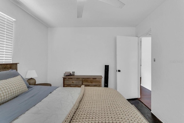 129 NW Lincoln Cir N, Saint Petersburg, FL 33702 - bedroom featuring a ceiling fan and dark wood-style floors