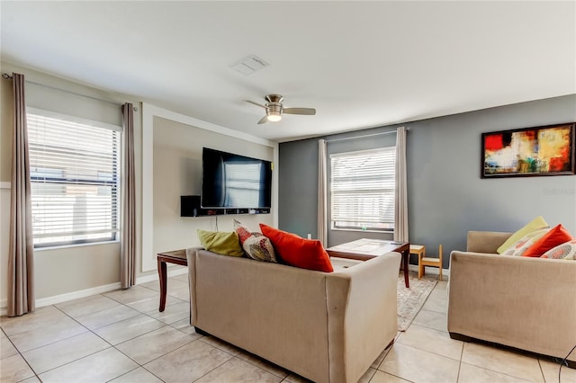living room featuring visible vents, baseboards, a ceiling fan, and light tile patterned flooring