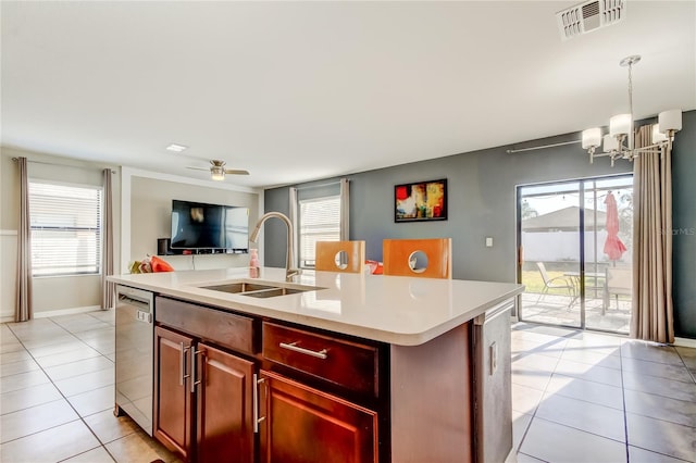 kitchen with visible vents, dishwasher, a sink, and light tile patterned floors