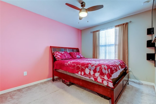 carpeted bedroom with baseboards and a ceiling fan