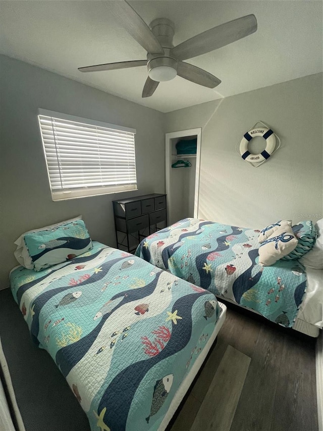 bedroom with wood finished floors and a ceiling fan