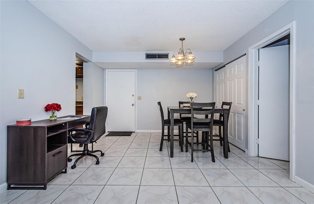 dining room featuring visible vents, baseboards, and a chandelier