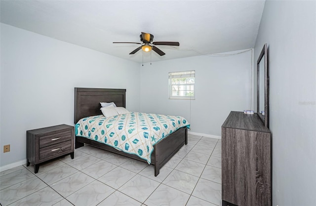 bedroom featuring baseboards and ceiling fan