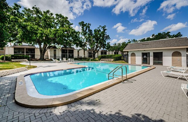 community pool with a patio