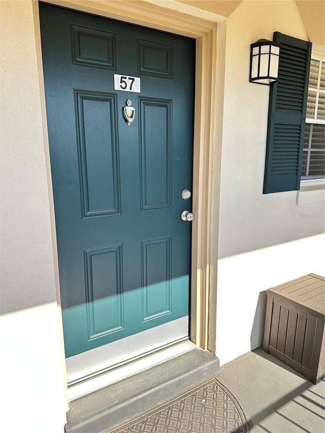 10316 Carrollwood Ct Unit 57, Tampa, FL 33618 - doorway to property featuring stucco siding