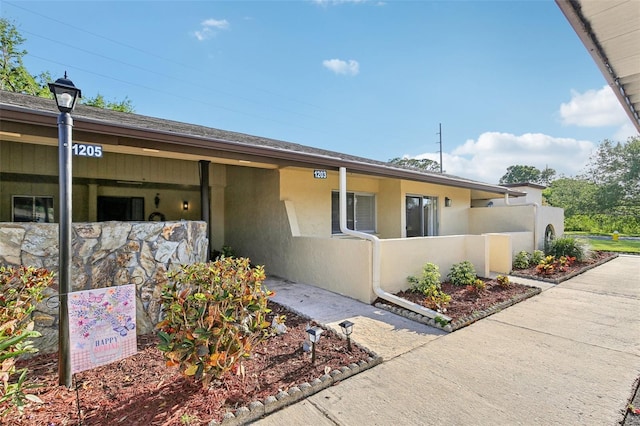 1203 16th Cir SE, Largo, FL 33771 - view of front of property featuring stucco siding
