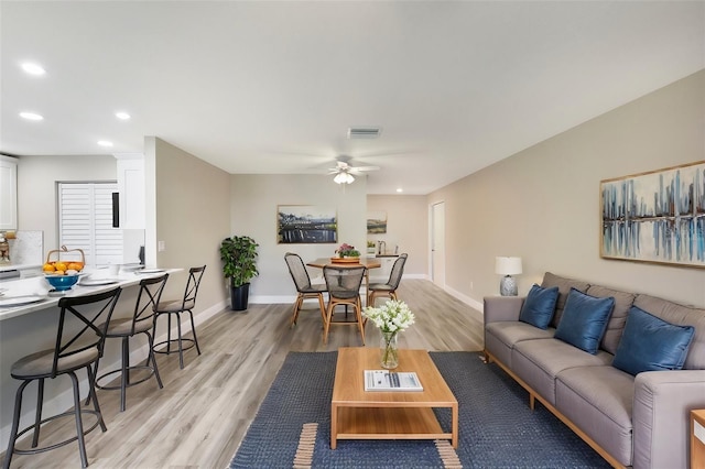 1203 16th Cir SE, Largo, FL 33771 - living area with recessed lighting, light wood-style floors, ceiling fan, and baseboards