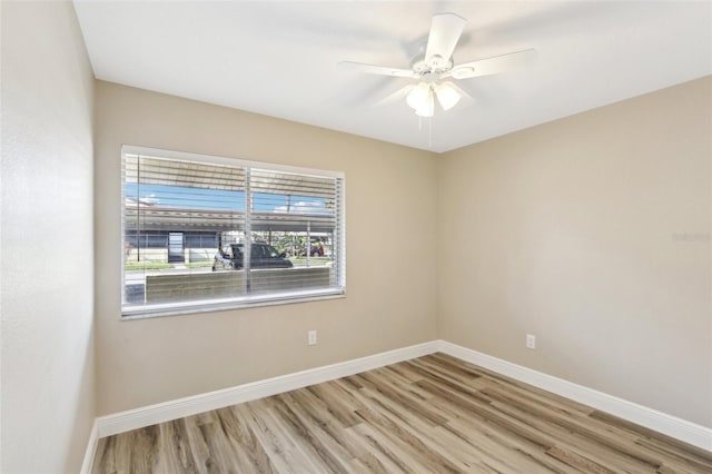 1203 16th Cir SE, Largo, FL 33771 - spare room featuring wood finished floors, baseboards, and ceiling fan