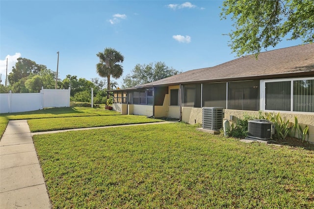 1203 16th Cir SE, Largo, FL 33771 - view of yard featuring cooling unit and a sunroom