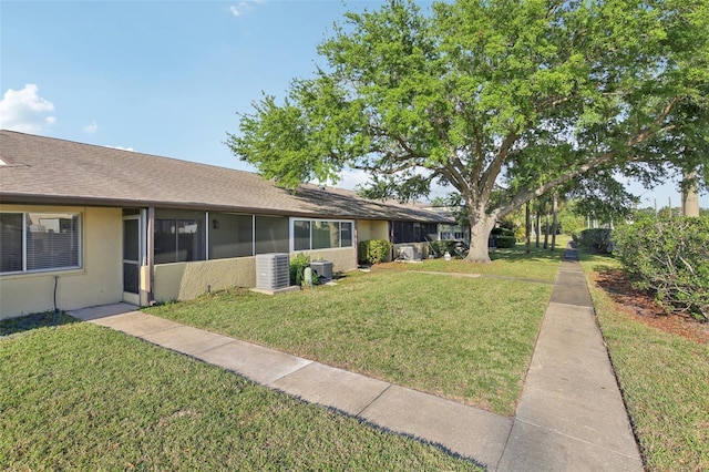 1203 16th Cir SE, Largo, FL 33771 - view of grassy yard with central AC unit