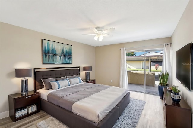 1203 16th Cir SE, Largo, FL 33771 - bedroom featuring wood finished floors, access to outside, ceiling fan, and baseboards