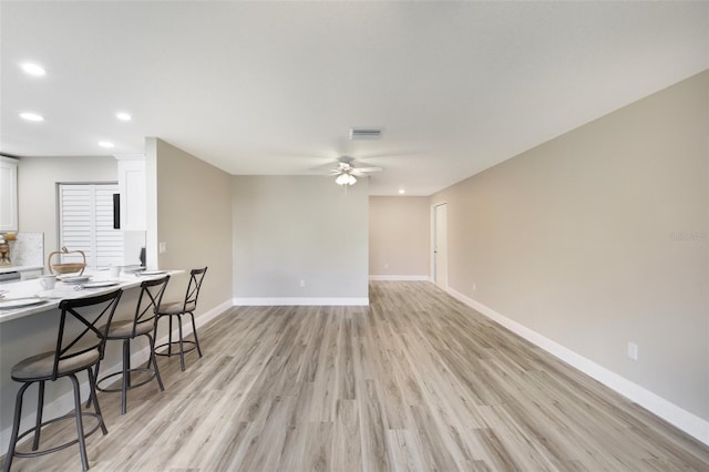 1203 16th Cir SE, Largo, FL 33771 - living room featuring recessed lighting, light wood finished floors, and ceiling fan
