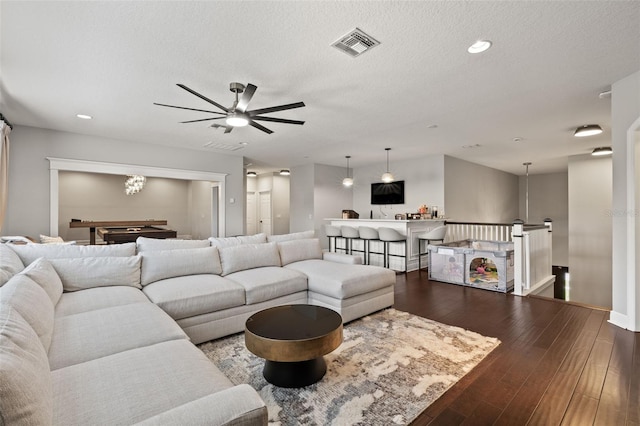 living room with visible vents, ceiling fan, a textured ceiling, recessed lighting, and hardwood / wood-style floors