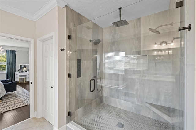 ensuite bathroom with a shower stall, tile patterned floors, ensuite bath, and ornamental molding
