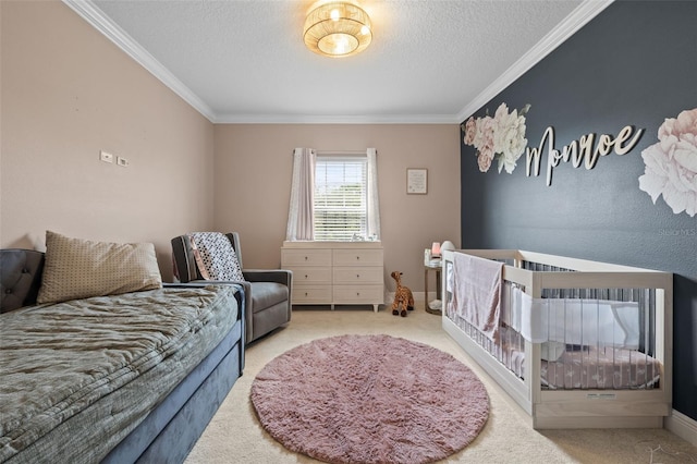 bedroom with baseboards, carpet flooring, a textured ceiling, and ornamental molding