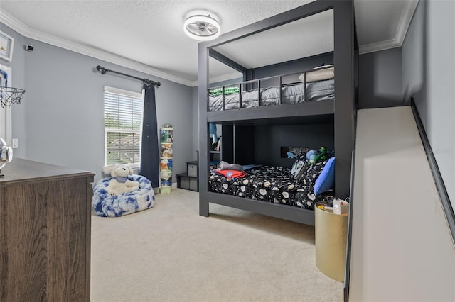 carpeted bedroom with crown molding and a textured ceiling