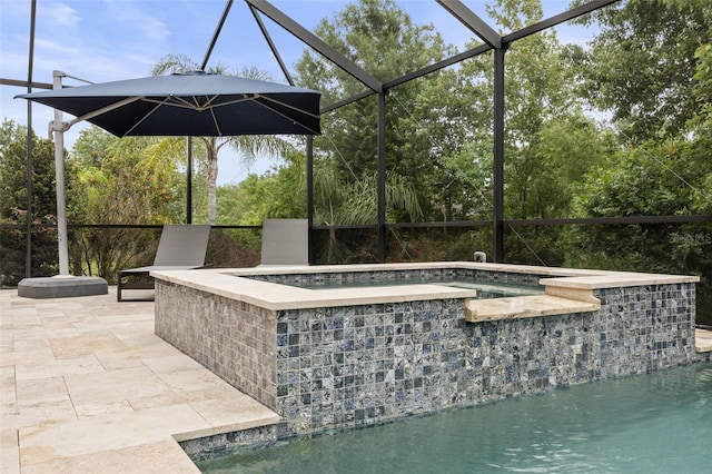 view of pool featuring a patio, an in ground hot tub, and glass enclosure