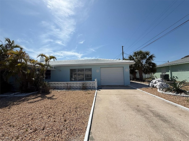 195 45th Ave, St Pete Beach, FL 33706 - single story home featuring an attached garage, concrete driveway, stucco siding, a tile roof, and central AC